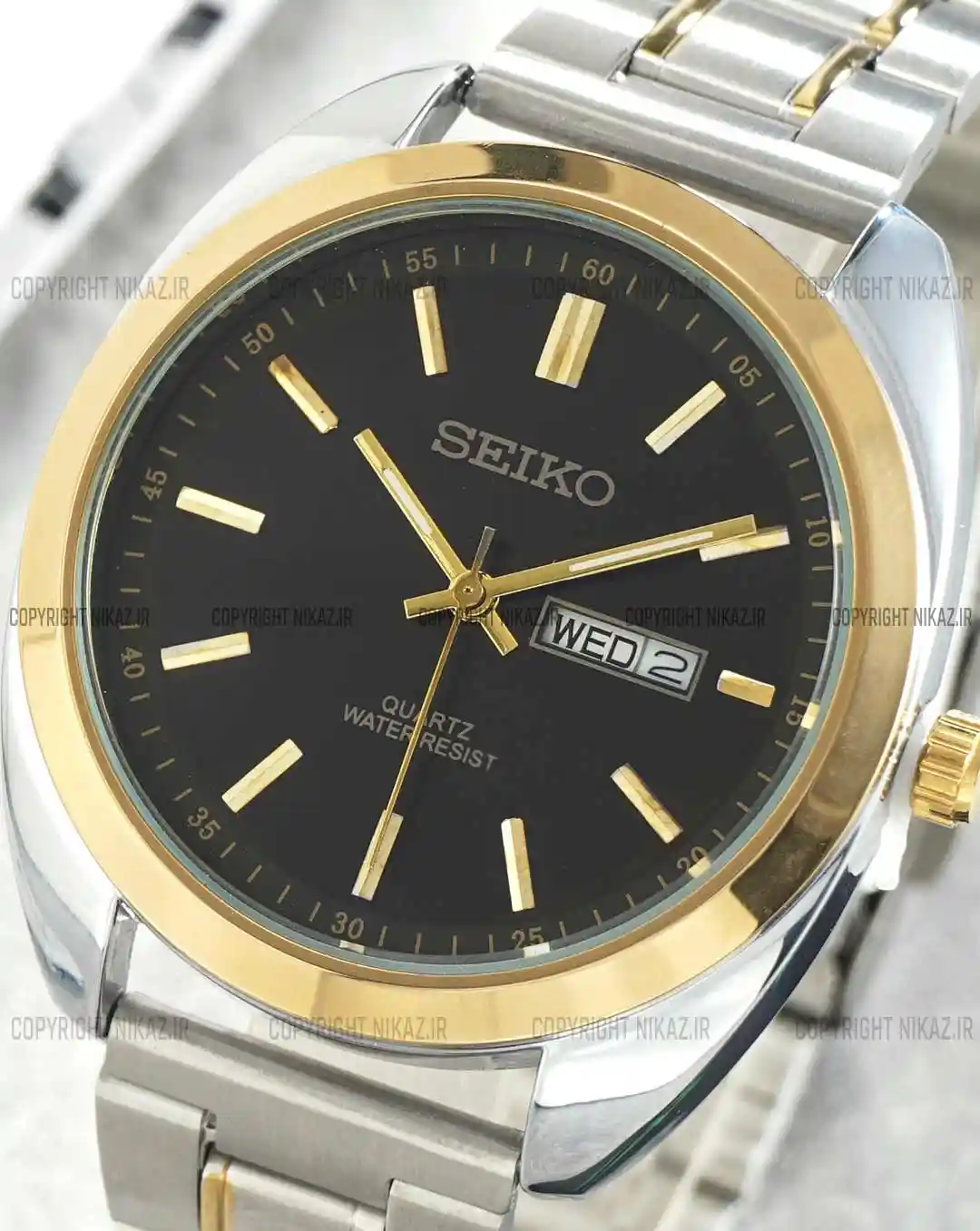 خرید ساعت مچی مردانه سیکو SEIKO کد 1264 موتور میوتا ژاپن بند استیل نقره ای طلایی و صفحه مشکی رنگ ثابت و دارای تقویم ایام هفته و ایام ماه