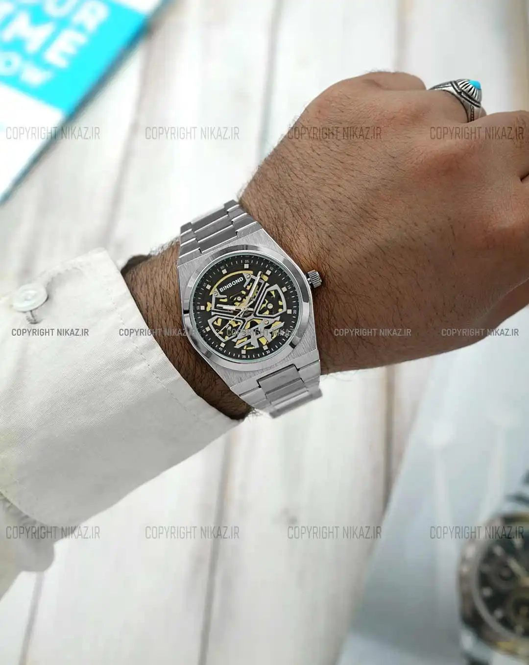 ساعت مچی مردانه بین باند BINBOND مدل B879 کد 1699 صفحه مشکی بند استیل نقره ای رنگ ثابت و موتور آرامگرد اپسون ژاپن اسکلتون